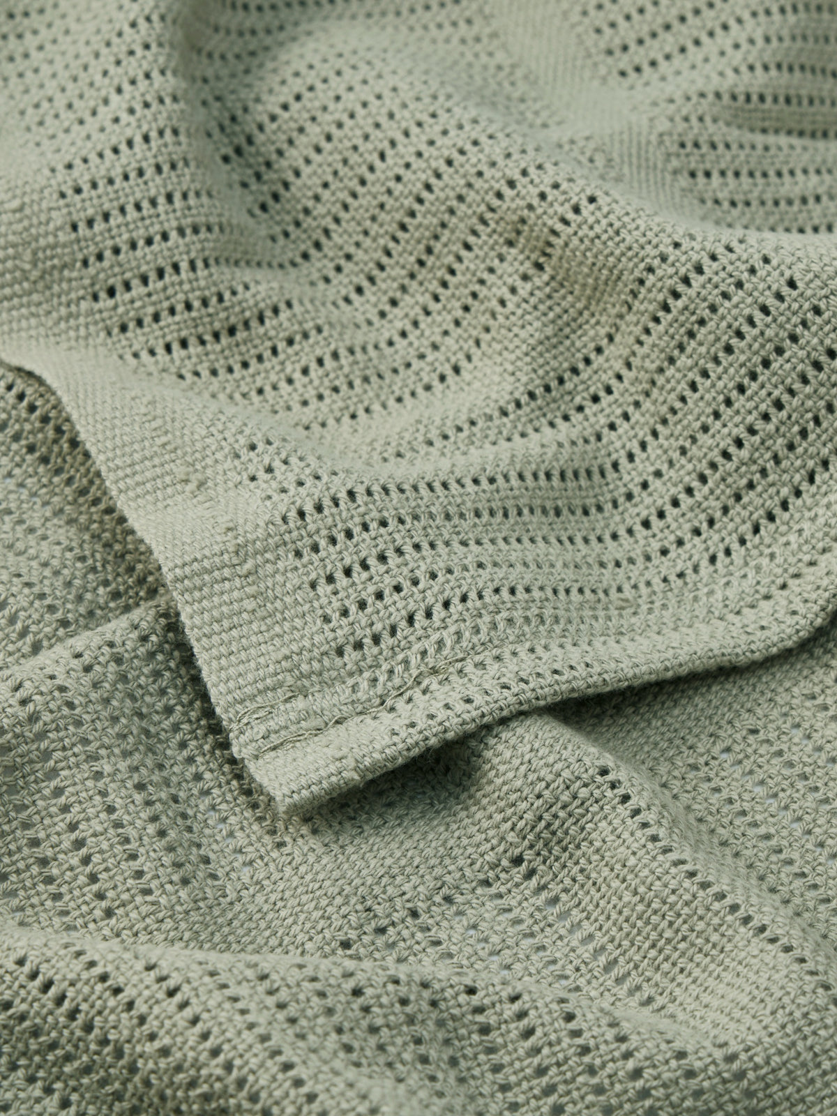 Close-up of the open cells in a Sage organic cotton cellular blanket